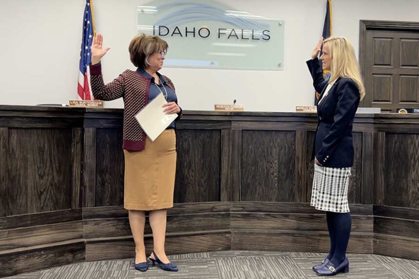 Outgoing Idaho Falls Mayor Rebecca Casper, left, administering the Oath of Office to Lisa Burtenshaw during Thursday night's city council meeting. | Rett Nelson, EastIdahoNews.com