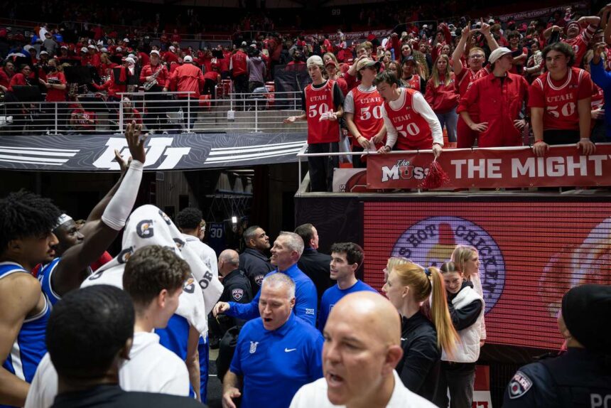 Utah Utes fans and BYU Cougars players gesture and jaw back and forth as the Cougars exit the arena after defeating Utah 89-84 at the Huntsman Center in Salt Lake City on Saturday, Jan. 10, 2026. (Photo: Scott G Winterton, Deseret News)