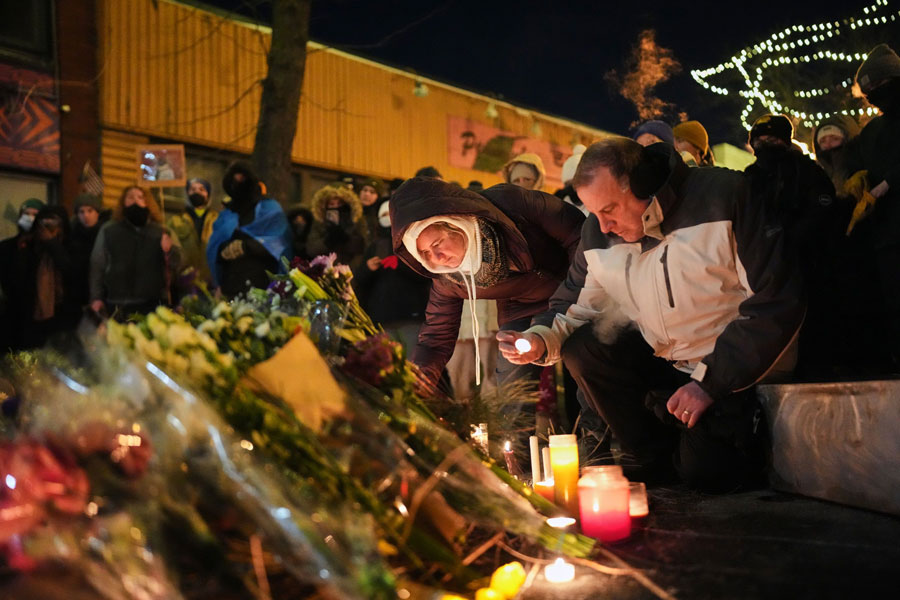 People gather during a vigil for 37-year-old Alex Pretti, who was fatally shot by a US Border Patrol officer earlier in the day, Saturday, January 24, 2026, in Minneapolis. | Adam Gray, AP via CNN