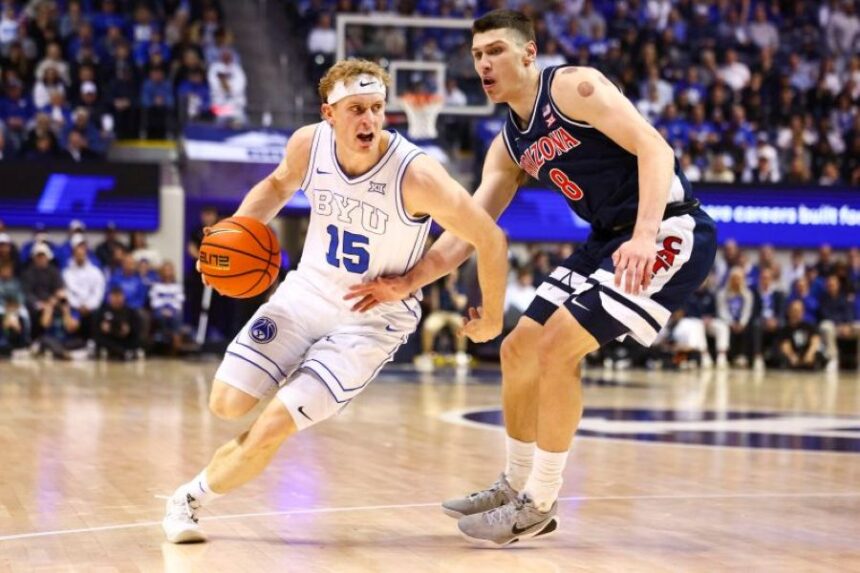 BYU guard Richie Saunders drives past Arizona forward Ivan Kharchenkov during Monday’s game in Provo. | Rio Giancarlo, Deseret News.