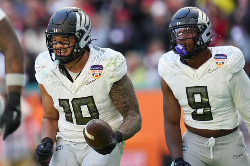 Oregon linebacker Matayo Uiagalelei (10) reacts after intercepting the football during the second half of the Orange Bowl College Football Playoff quarterfinal game against Texas Tech, Thursday, Jan. 1, 2026, in Miami Gardens, Fla. (AP Photo/Lynne Sladky)
