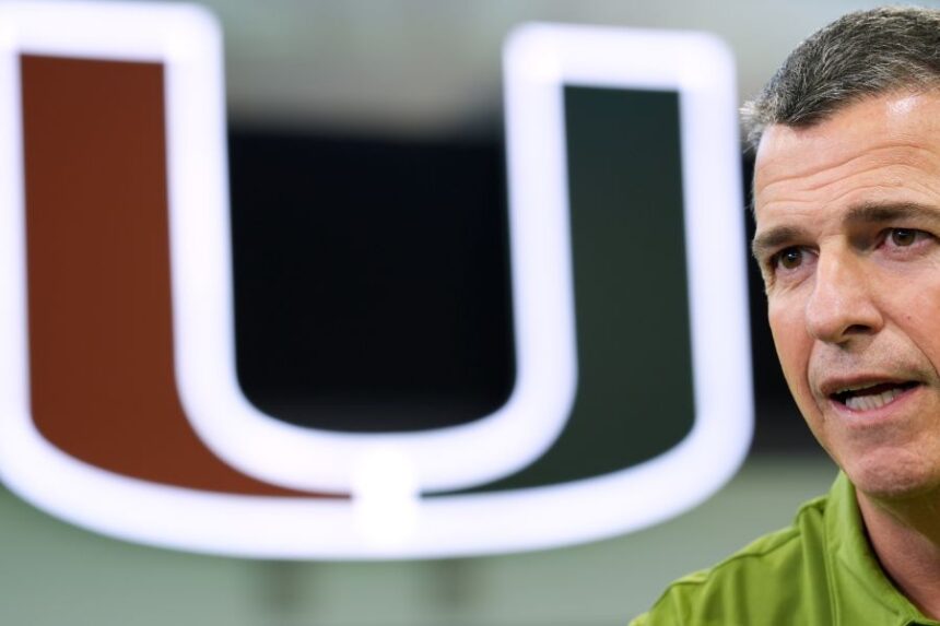 Miami football head coach Mario Cristobal speaks during an interview on the team's indoor practice field in Coral Gables, Fla., Monday, Jan. 12, 2026. (AP Photo/Rebecca Blackwell)