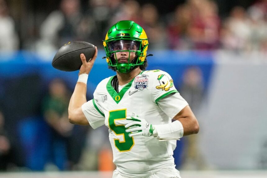 Oregon quarterback Dante Moore (5) passes against Indiana during the second half of the Peach Bowl NCAA college football playoff semifinal, Friday, Jan. 9, 2026, in Atlanta. (AP Photo/Brynn Anderson)
