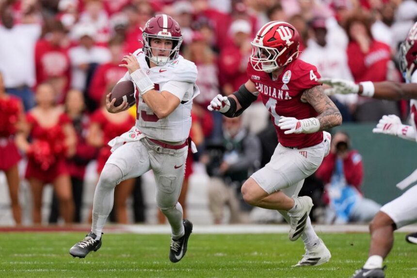 Alabama quarterback Ty Simpson (15) is chased by Indiana linebacker Qua Russaw (4) during the first half of the Rose Bowl College Football Playoff quarterfinal game Thursday, Jan. 1, 2026, in Pasadena, Calif. (AP Photo/Mark J. Terrill)