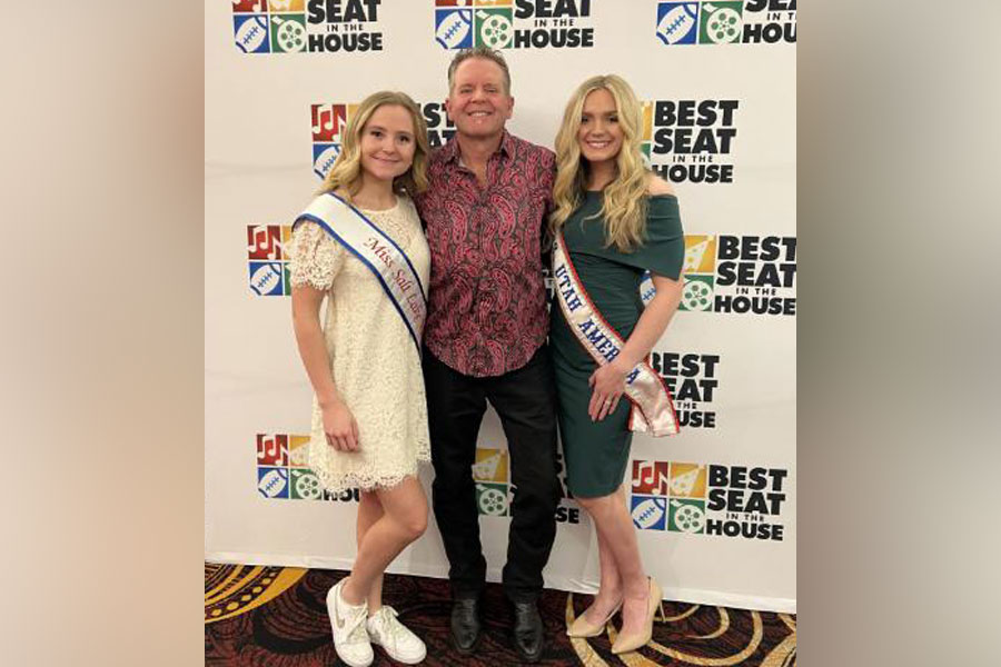 Oaklee Toone, left, and Baylee Demars, right, are pose for a photo with their father, Kory Toone.