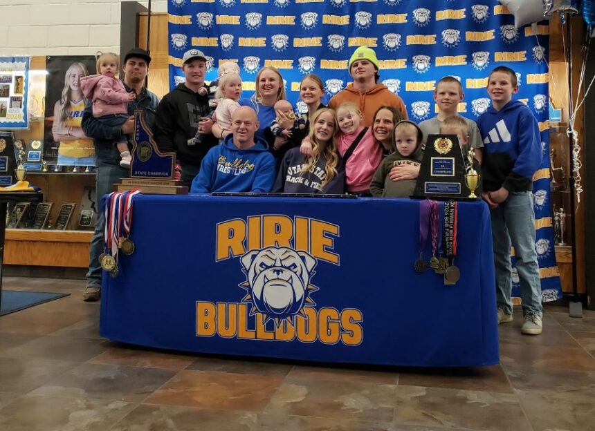 Ririe's Lucy Boone and family celebrate her signing to run cross country and track at Utah State. | Allan Steele, asteele@eastidahosports.com.