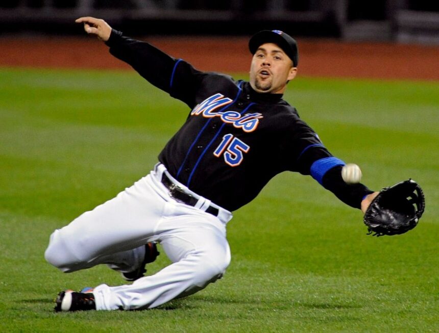 FILE - New York Mets right fielder Carlos Beltran lunges for the ball during the third inning of an MLB baseball game against the Arizona Diamondbacks, April 22, 2011 in New York. (AP Photo/Bill Kostroun, File)