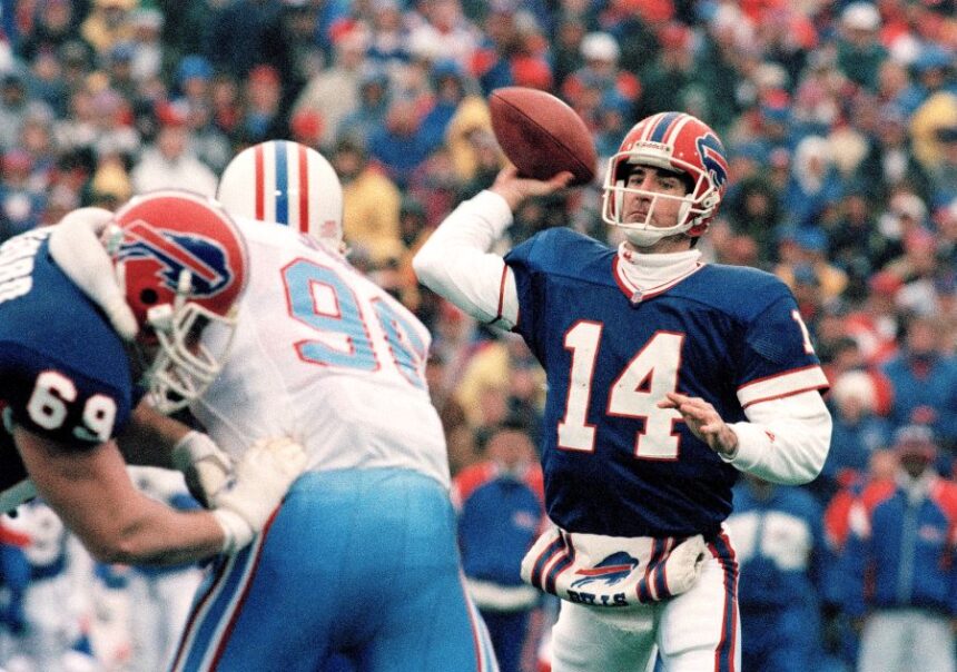 FILE - Buffalo Bills quarterback Frank Reich passes against the Houston Oilers in an NFL football game at Rich Stadium in Orchard Park, N.Y., Jan. 3, 1993. (AP Photo/John Hickey, File)