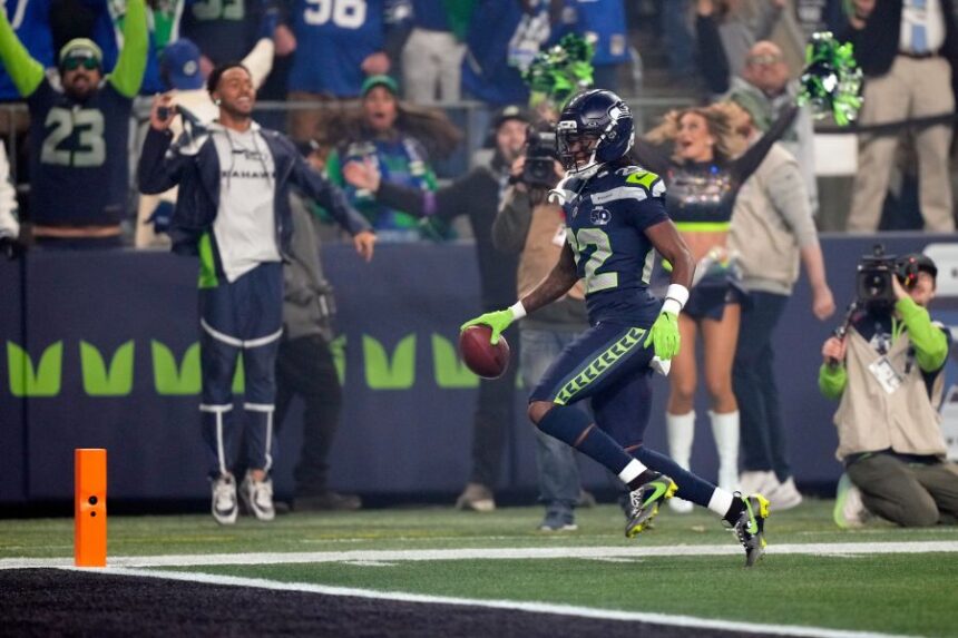 Seattle Seahawks wide receiver Rashid Shaheed (22) runs a kickoff return in for a touchdown during the first half of an NFL football divisional playoff game against the San Francisco 49ers, Saturday, Jan. 17, 2026, in Seattle. (AP Photo/Stephen Brashear)