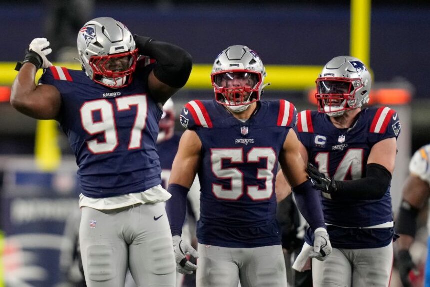 New England Patriots defensive end Milton Williams (97), linebacker Christian Elliss (53) and linebacker Robert Spillane (14) celebrate Williams' sack of Los Angeles Chargers quarterback Justin Herbert (10) in the second half of an NFL wild-card playoff football game in Foxborough, Mass., Sunday, Jan. 11, 2026. (AP Photo/Charles Krupa)