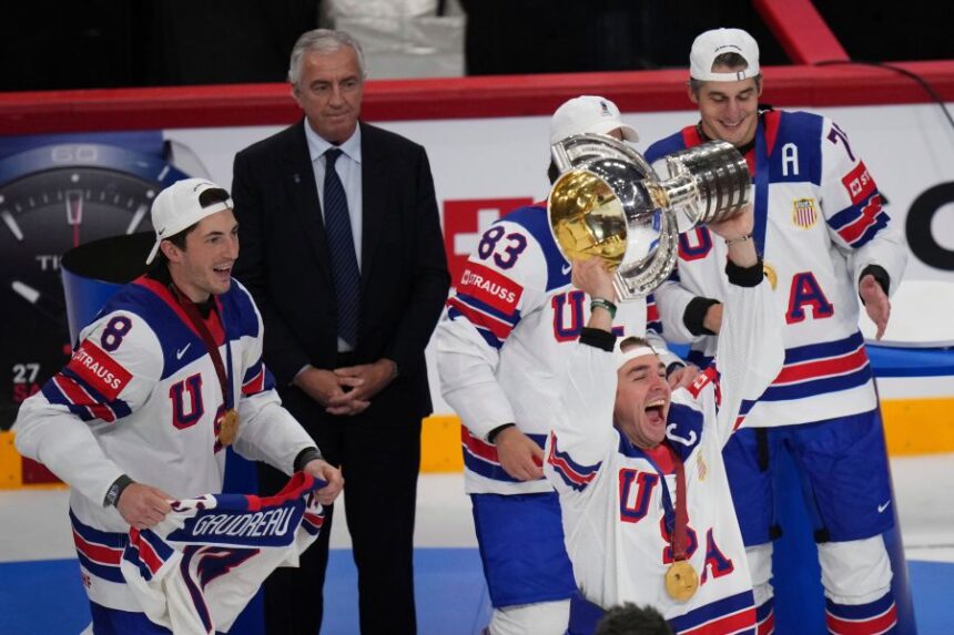 FILE - United States' Clayton Keller holds up the tropy after the final match between United States and Switzerland at the ice hockey world championships in Stockholm, Sweden, Sunday, May 25, 2025. (AP Photo/Petr David Josek, File)