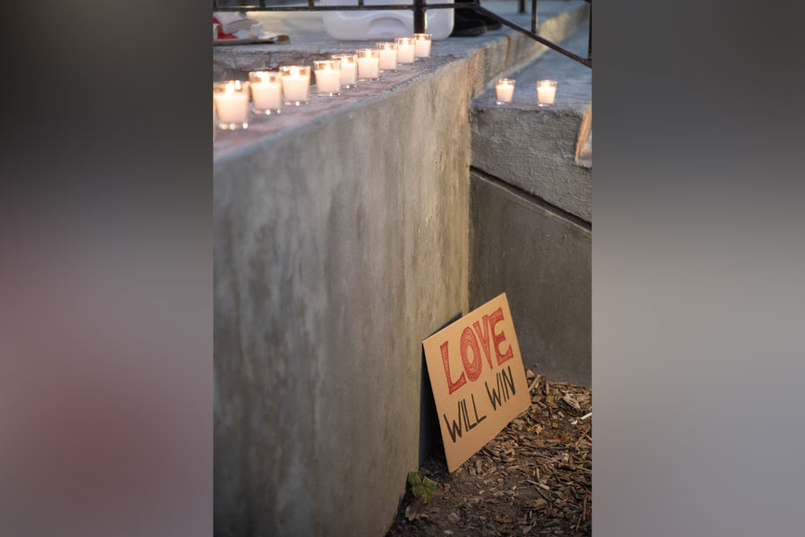 E55I8582: A sign stating “Love Will Win” is propped against a wall during a candlelight vigil Sunday. | Cody Roberts, EastIdahoNews.com