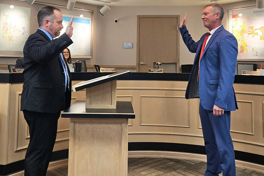 Ammon Mayor Brian Powell being sworn in by former Ammon Mayor, Sean Coletti.