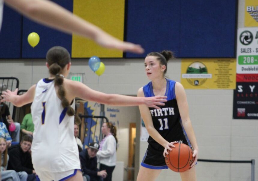 Firth's Shelbie Perry looks to pass against the Ririe defense during Friday's game. | Allan Steele, EastIdahoSports.com.
