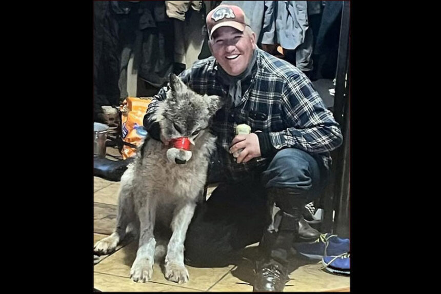 Cody Roberts with wolf