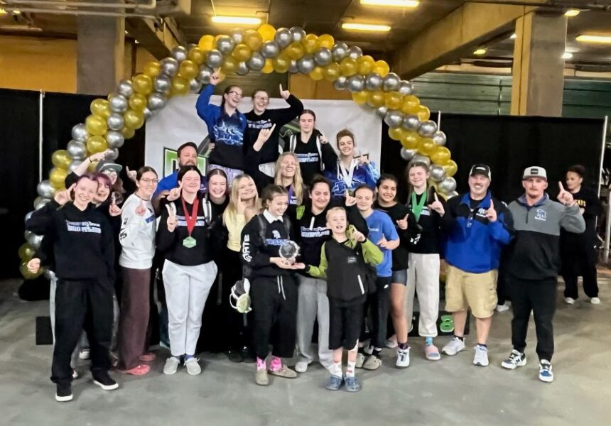 The Thunder Ridge girls wrestling team celebrates a team championship at the Rollie Lane tournament. | Courtesy photo.