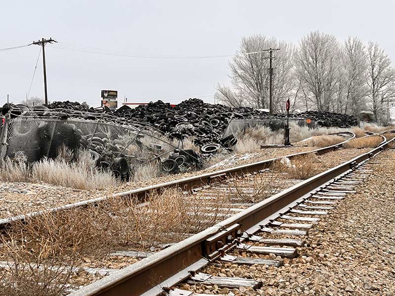 The pile of tires sits next to a rail line on Iona Road | Rett Nelson, EastIdahoNews.com