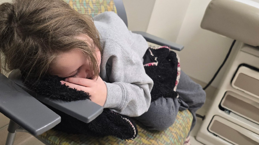 Valerie asleep while awaiting more testing at the hospital. | Courtesy of Katelynn Jensen