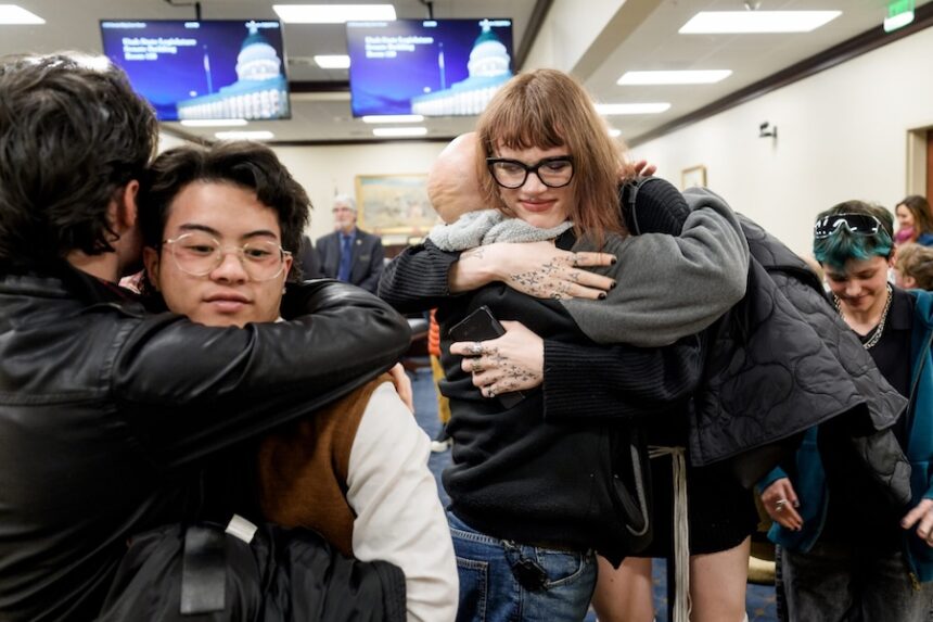 Benjamin and Cyrus Espiritu, left, and Michael Massimi and his daughter Blaire celebrate after HB193 failed in the Senate Business and Labor Standing Committee, at the Capitol in Salt Lake City on Thursday, Feb. 19, 2026.