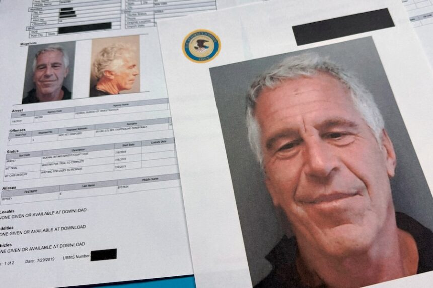 FILE - Documents that were included in the U.S. Department of Justice release of the Jeffrey Epstein files are photographed Friday, Jan. 2, 2026.