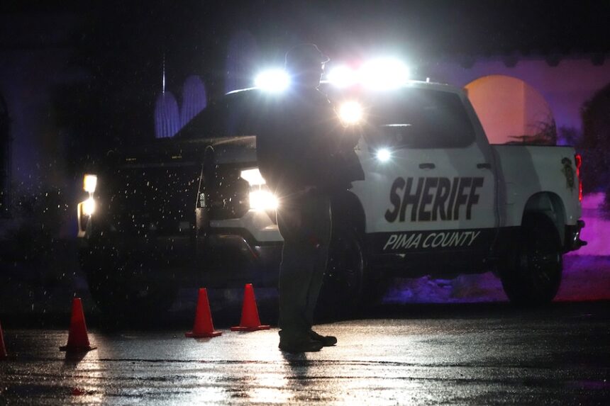 Pima County sheriff's deputies block a road near Nancy Guthrie's home in Tucson, Ariz., on Friday, Feb. 13, 2026.