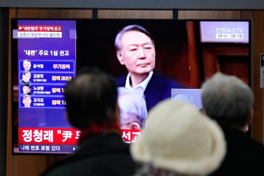 A TV screen shows an image of former South Korea President Yoon Suk Yeol during a news program at the Seoul Railway Station in Seoul, South Korea, Thursday, Feb. 19, 2026.