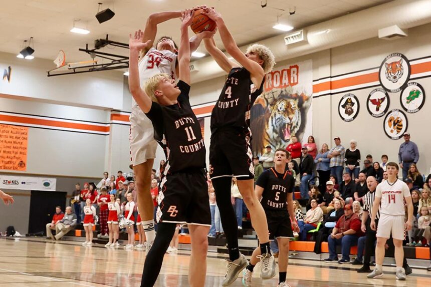 Grace Parker Yost and Butte County Dean Rogers (14) battle for a rebound in the 2A title game