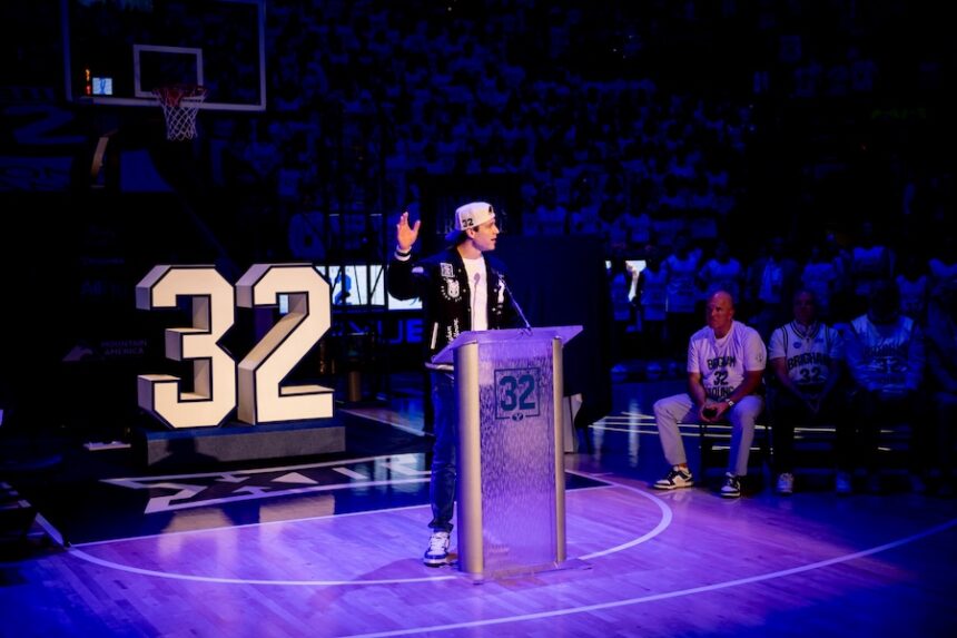BYU’s Jimmer Fredette speaks as his No. 32 jersey is retired and hung in the rafters during a halftime ceremony during a game against the Colorado Buffaloes at the Marriott Center in Provo on Saturday, Feb. 14, 2026.
