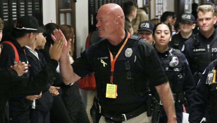 Former Ogden police officer is pictured at Ogden High School in the wake of a March 29, 2023, hoax call to the school. He helped lead the response to the call. | Ogden High School Facebook