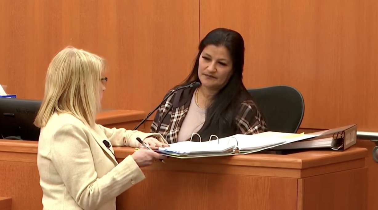 Carmen Lauber, who testified about providing drugs to Kouri Richins, looks at a binder with Richins' attorney Wendy Lewis on Thursday. (Photo: David Chernak)