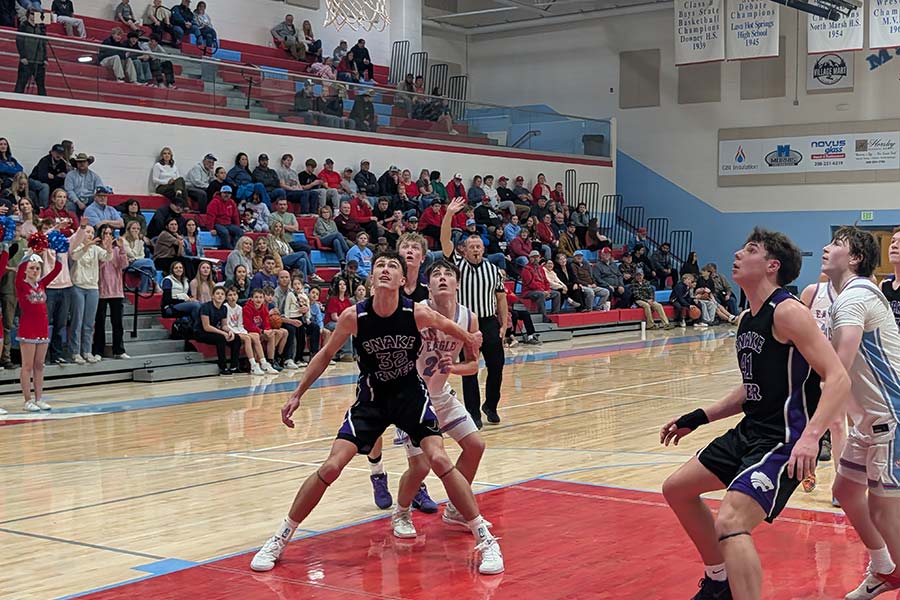 Snake River Owen Jones (41) and Bridjer Howard (32) battle for rebounding position