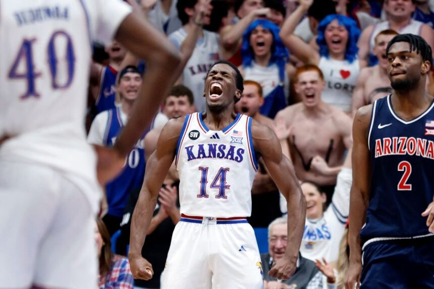 Kansas guard Melvin Council Jr. (14) reacts after scoring during the second half of an NCAA college basketball game against Arizona, Monday, Feb. 9, 2026, in Lawrence, Kan. (AP Photo/Colin E. Braley)