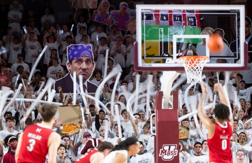 The Massachusetts student section cheers as Miami Ohio wing Eian Elmer (0) attempts a free throw during the NCAA basketball game at The Mullins Center in Amherst, Mass., Tuesday, Feb. 17, 2026. (Daniel Jacobi II/The Daily Hampshire Gazette via AP)