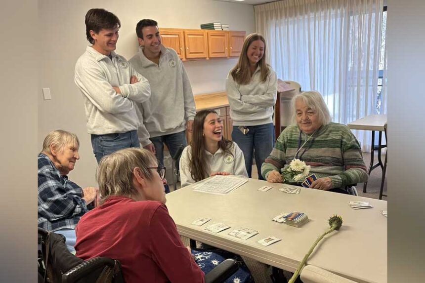 Friends and Flowers volunteers deliver flowers and conversation for Valentine's Day to residents of a nursing home.