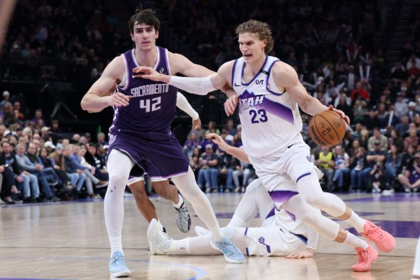 Utah Jazz forward Lauri Markkanen (23) drives to the basket against Sacramento Kings center Maxime Raynaud (42) during the second half of an NBA basketball game, Wednesday, Feb. 11, 2026, in Salt Lake City. (AP Photo/Rob Gray)