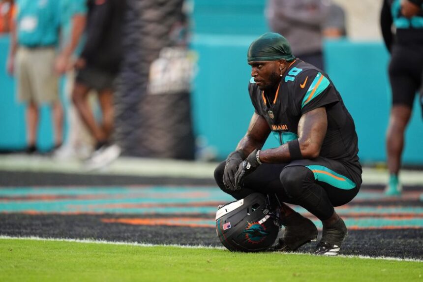 FILE - Miami Dolphins' Tyreek Hill looks toward the field son the sideline before an NFL football game against the New York Jets, Sept. 29, 2025, in Miami Gardens, Fla. (AP Photo/Rebecca Blackwell, file)