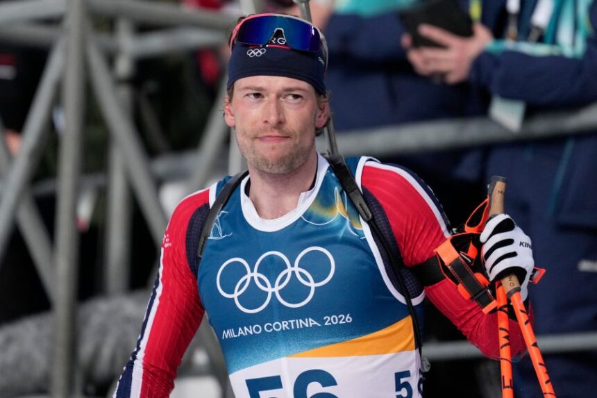 Sturla Holm Laegreid, of Norway, reacts in the finish area of the men's 10-kilometer sprint biathlon race at the 2026 Winter Olympics in Anterselva, Italy, Friday, Feb. 13, 2026. (AP Photo/Mosa'ab Elshamy)