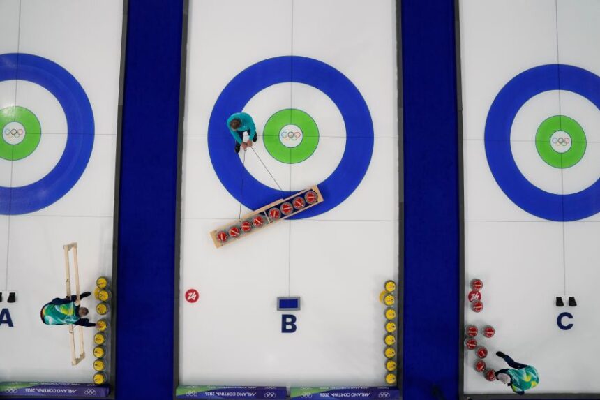 Preparations for the first curling competition are made at the 2026 Winter Olympics in Cortina d'Ampezzo, Italy, Wednesday, Feb. 4, 2026. (AP Photo/David J. Phillip)