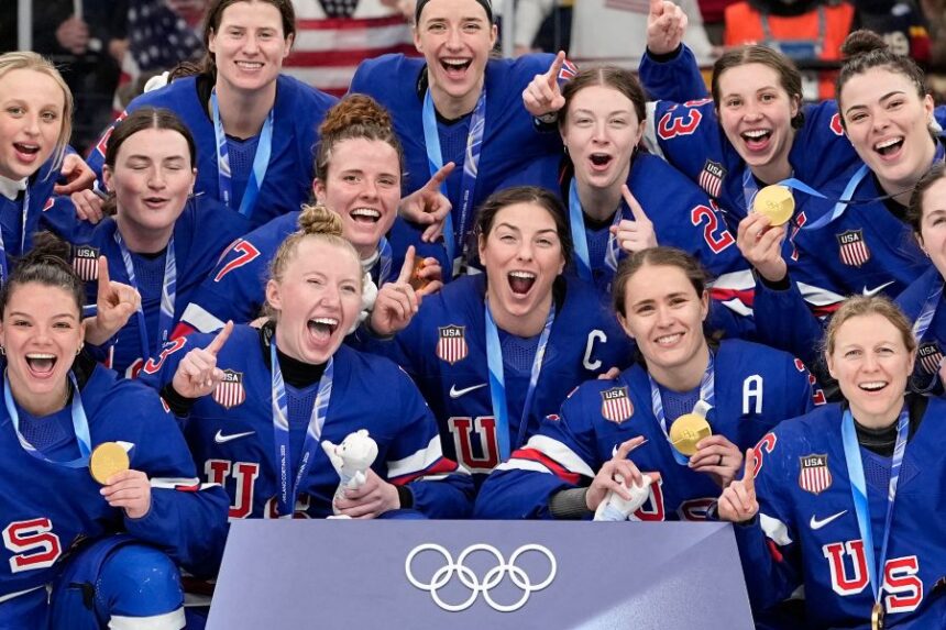 United States' team celebrate after victory ceremony for women's ice hockey at the 2026 Winter Olympics, in Milan, Italy, Thursday, Feb. 19, 2026. (AP Photo/Hassan Ammar)