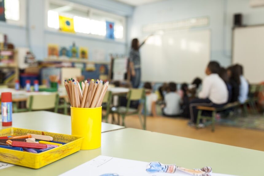 pens and paints on table in a primary school class