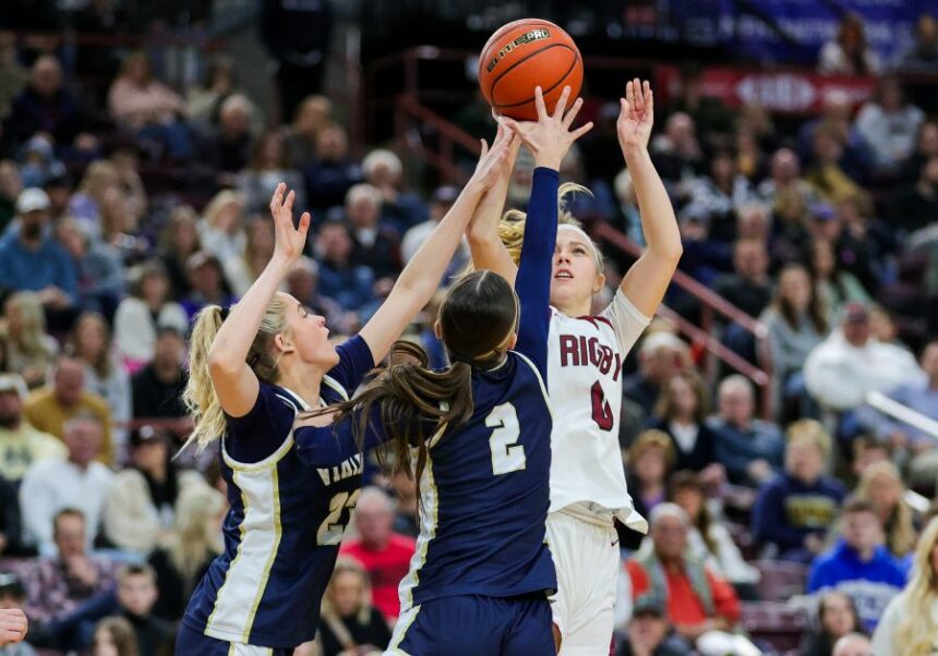 Rigby’s Bailey Barber (5) puts up a three point shot against Middleton in their semi-final match up Friday. Photo by Steve Conner