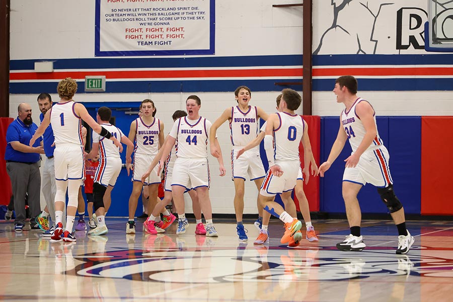 Rockland boys celebrate during a timeout, beating Watersprings