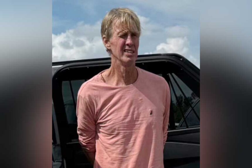 Law enforcement officers arrest Ryan Wesley Routh, a man suspected in an apparent assassination attempt of Donald Trump