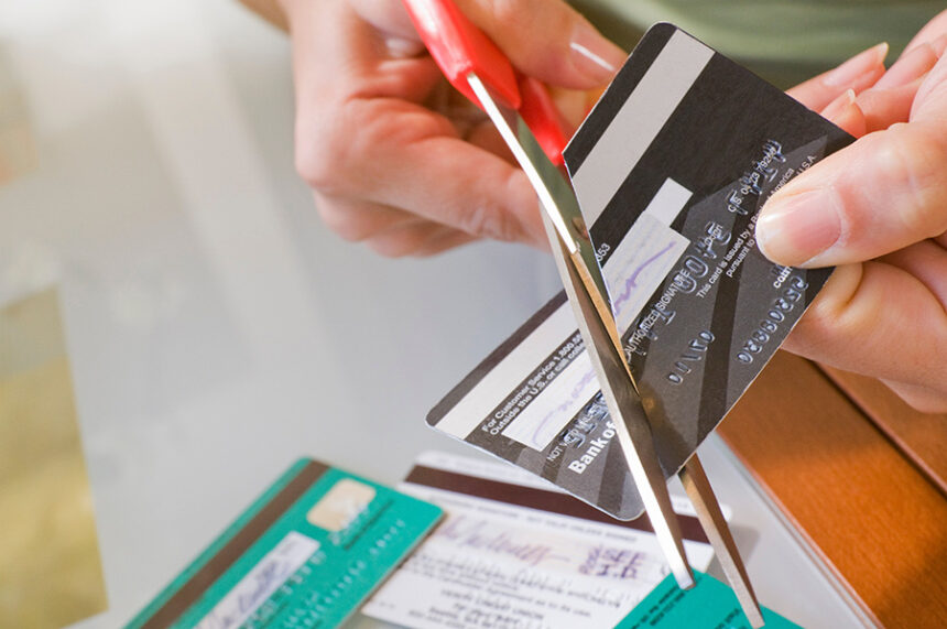 woman cutting credit cards 2026 01 05 23 30 48 utc