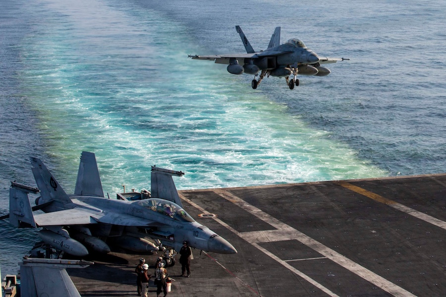 This image provided by U.S. Central Command shows a F/A-18E Super Hornet preparing to make an arrested landing on the USS Abraham Lincoln (CVN 72) after a mission in support of Operation Epic Fury, on Saturday, Feb. 28, 2026.