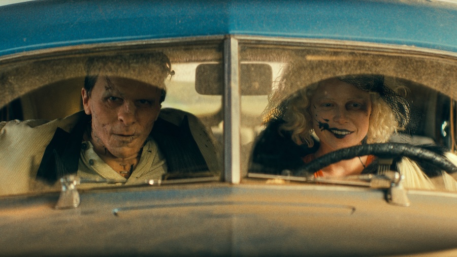 This image released by Warner Bros Entertainment shows Christian Bale, left, and Jessie Buckley in a scene from "The Bride!" (Warner Bros Entertainment via AP)