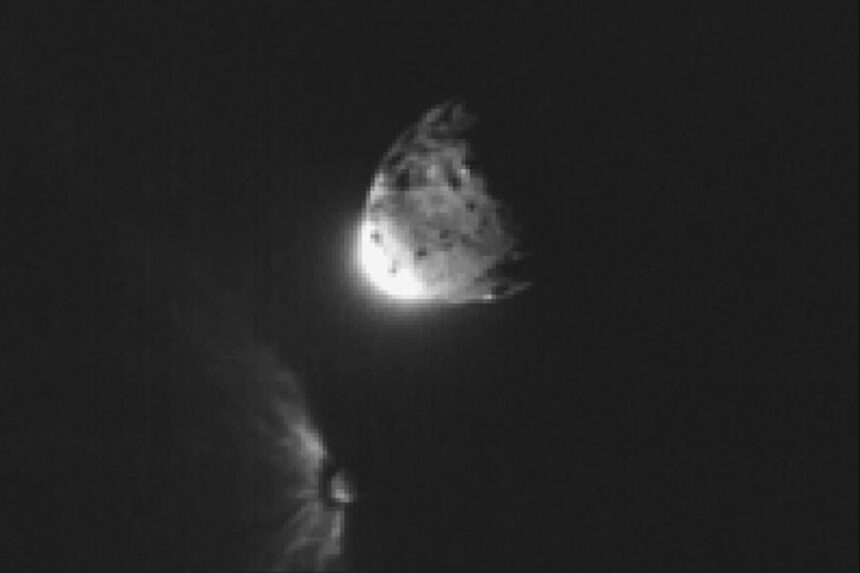 In this image provided by NASA, an impact plume emerges from the asteroid Dimorphos, left, after DART collides into it on Sept. 26, 2022, orbiting the larger asteroid Dimorphos.