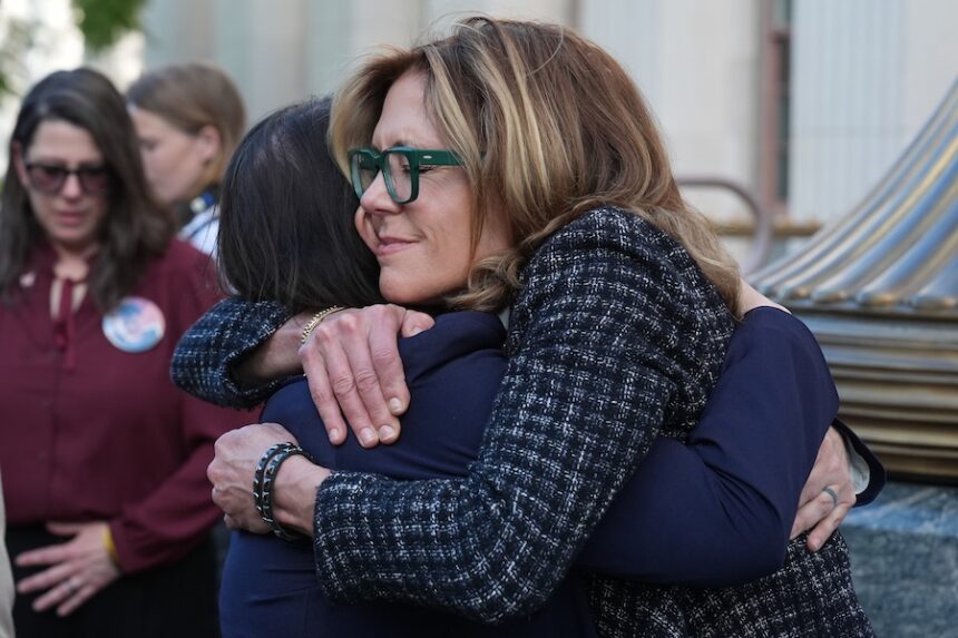 Laura Marquez-Garrett, attorney for SMVLC (Social Media Victims Law Center), embraces Julianna Arnold, right, parent, outside Los Angeles Superior Court on Thursday, March 12, 2026.