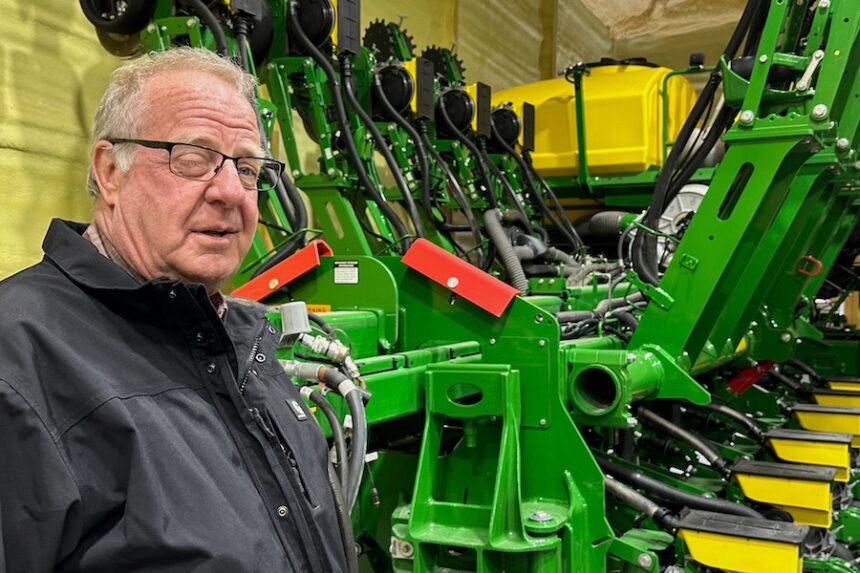 Tom Waters, a seventh-generation farmer, stands next to his planting machinery Friday, March 13, 2026, in Orrick, Mo.