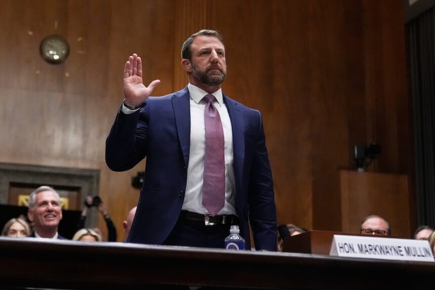 Sen. Markwayne Mullin, R-Okla., President Donald Trump's pick for Homeland Security secretary, is sworn in before testifying during Senate Committee on Homeland Security and Governmental Affairs hearing, Wednesday, March 18, 2026 on Capitol Hill in Washington.